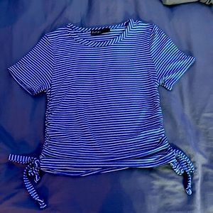 White and blue shirt with adjustable sides. Super cute and comfy.